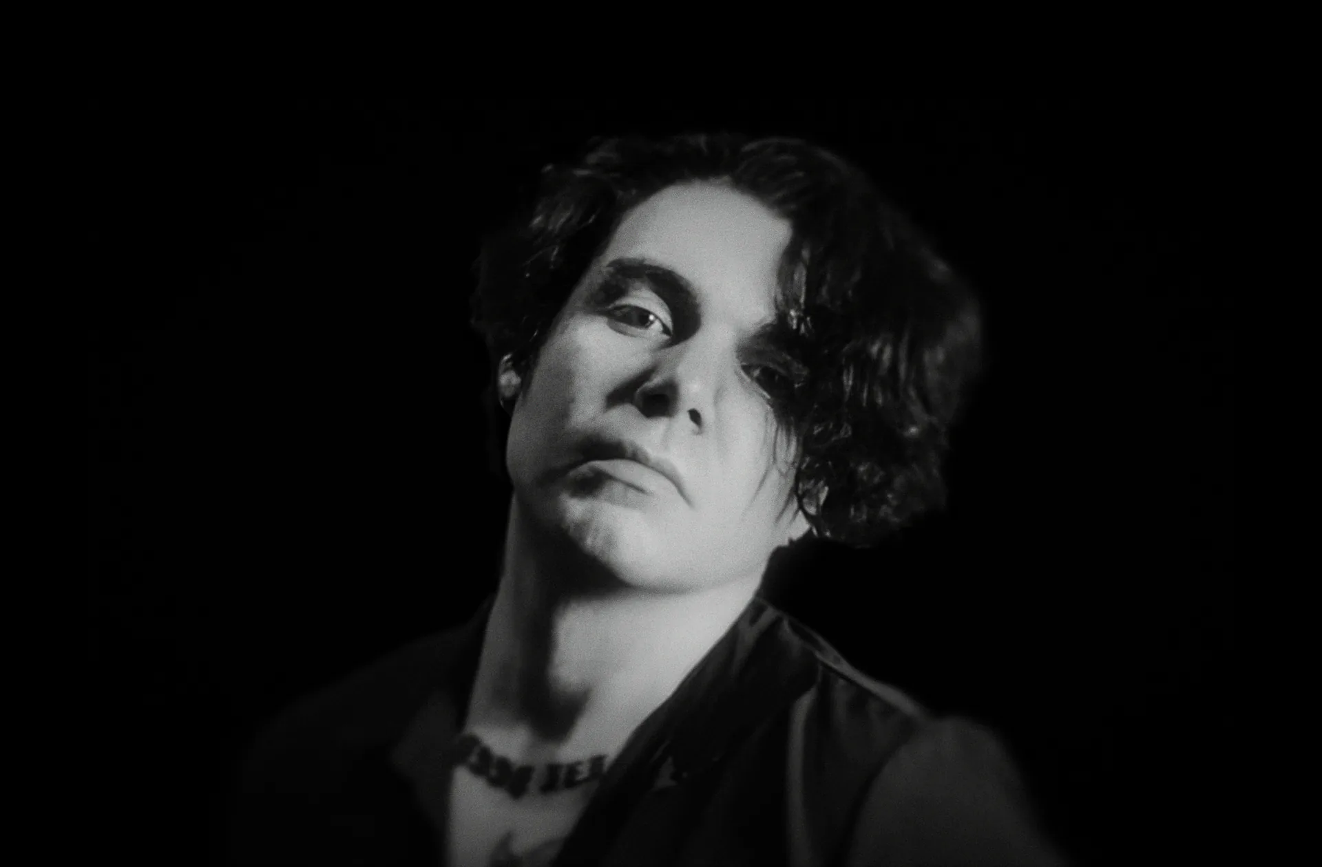 James Laurent in a black-and-white three-quarter portrait