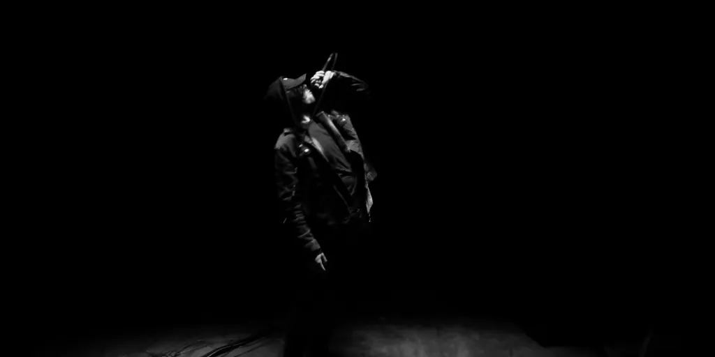 James Laurent performing under hard stage light
